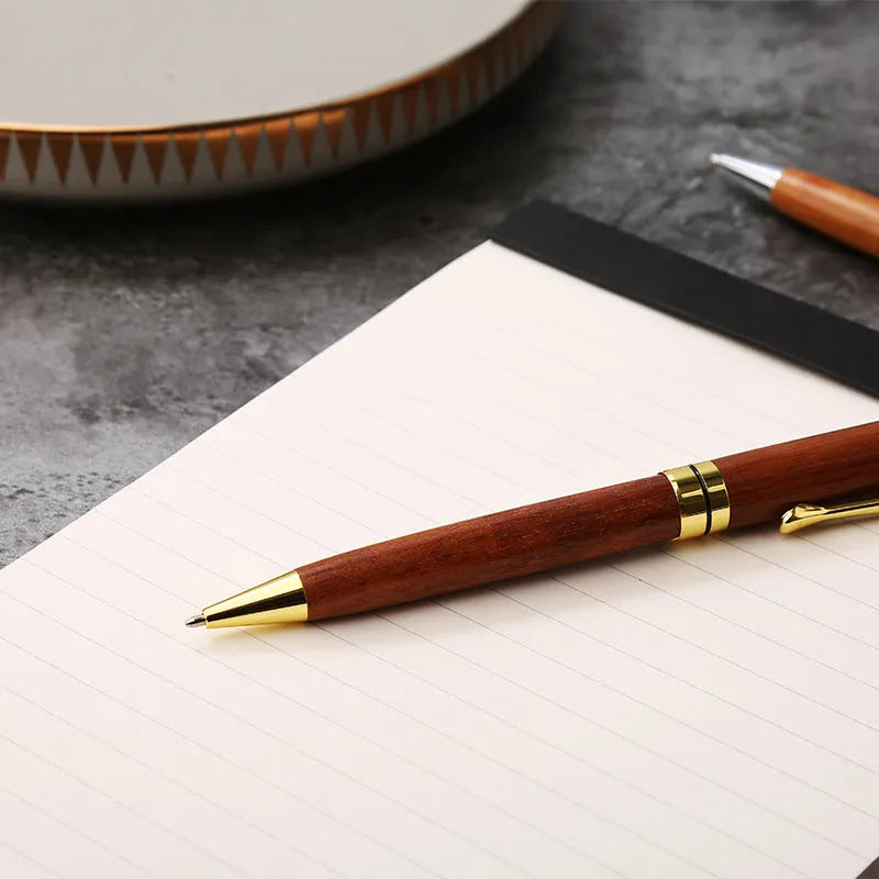 Wooden metal ballpoint pen with rosewood barrel on desk surface, 14cm length, gold colour option