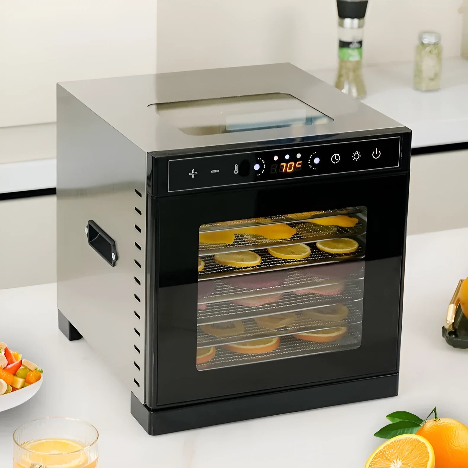 Stainless steel food dehydrator with digital LED panel and multiple stacking trays.
