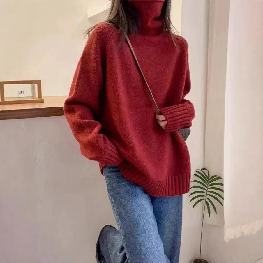 Women's loose turtleneck sweater in thick polyester mesh with curling pile collar, shown in solid colour.