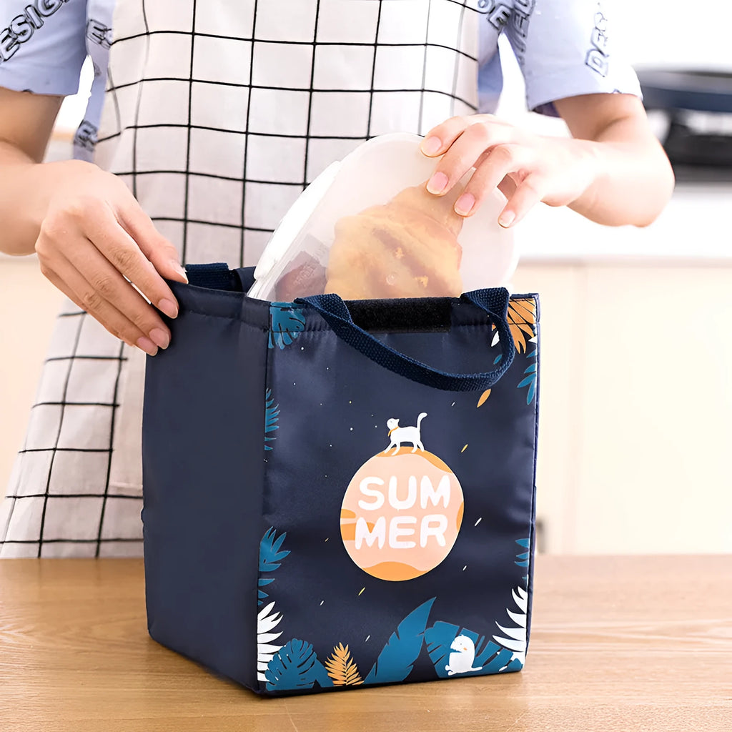 Insulated lunch bag with thermal lining showing character designs including grey unicorn and navy blue planet cat patterns