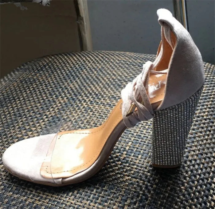 Black and gold pointed toe high heels for women, plastic upper and sole.