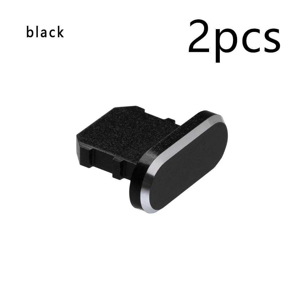 Aluminium alloy iPhone charging port dust plug in metallic colours on a dark background.