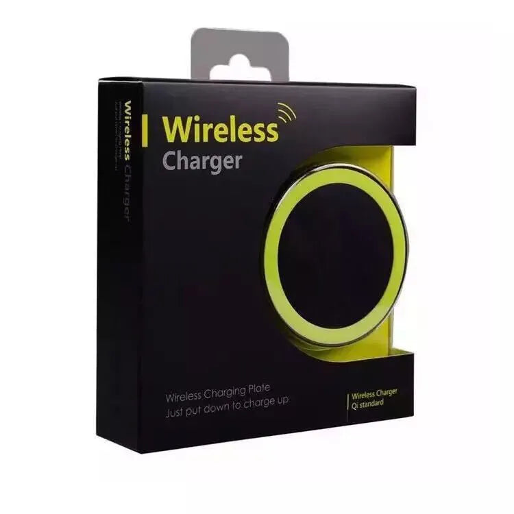 Qi wireless charging pad for mobile phones in six colour options on a wooden surface