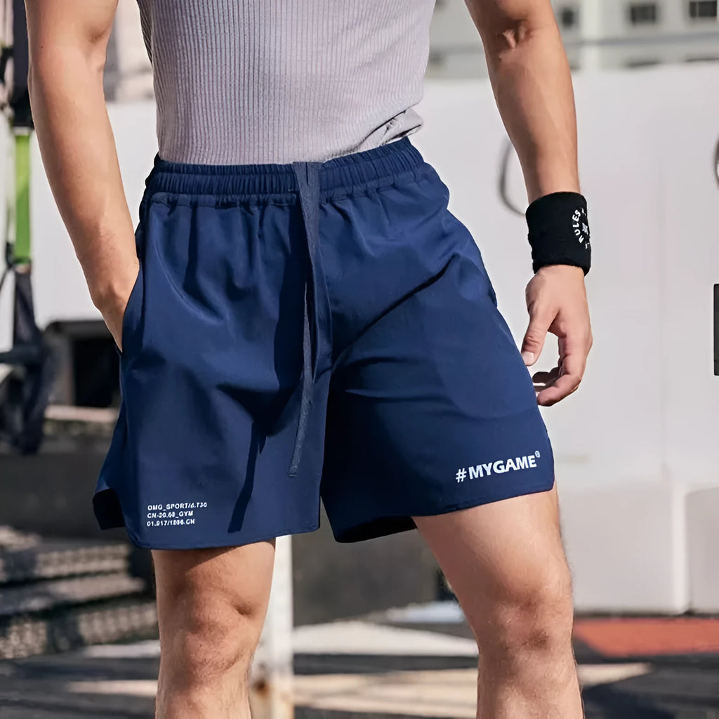 Men's grey fitness training shorts with a short-length cut, shown on a manikin for summer workout wear.