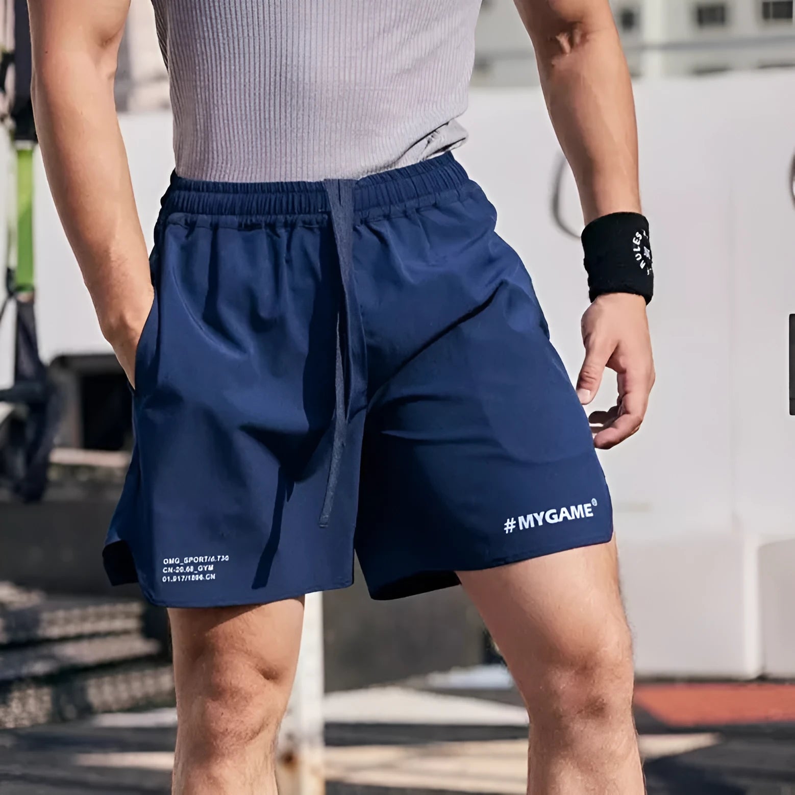 Men's grey fitness training shorts with a short-length cut, shown on a manikin for summer workout wear.