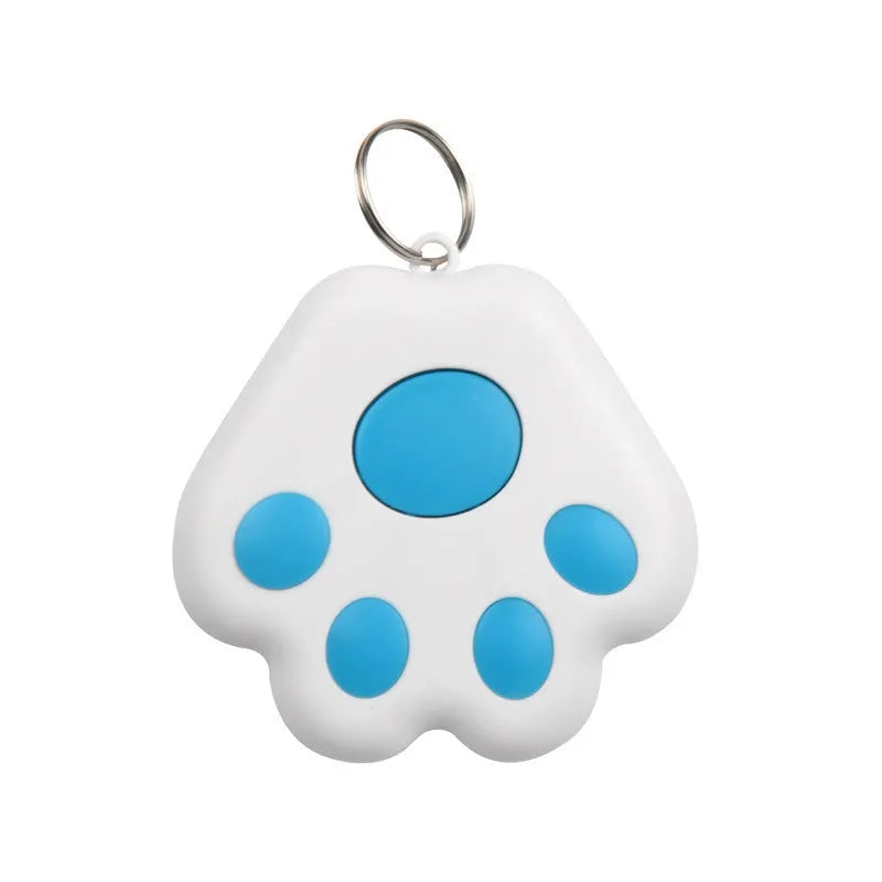 Small black dog paw shaped Bluetooth anti-lost device with key ring, shown next to a mobile phone.