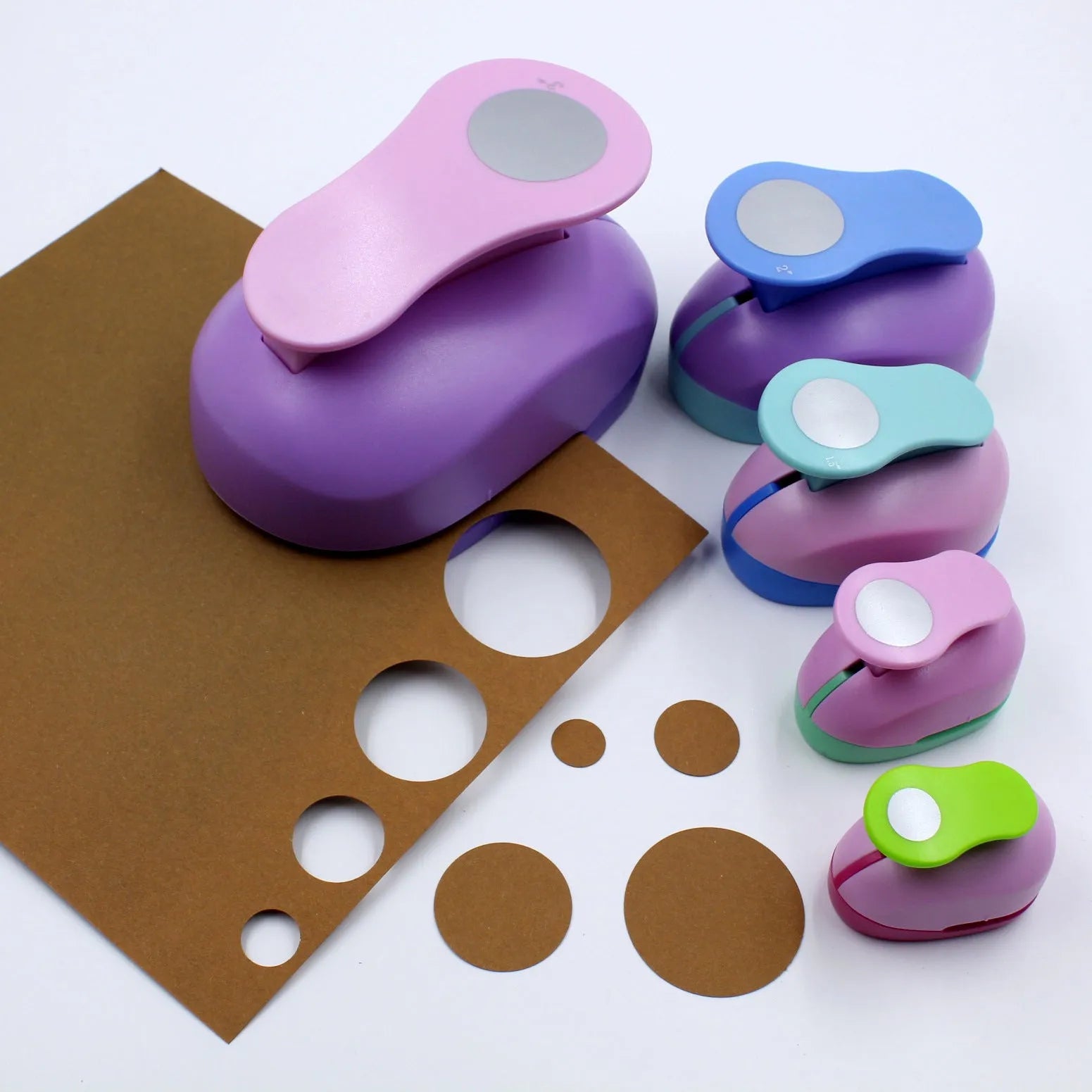 Colourful children's round embossing machine tool with zinc alloy mechanism on a card.