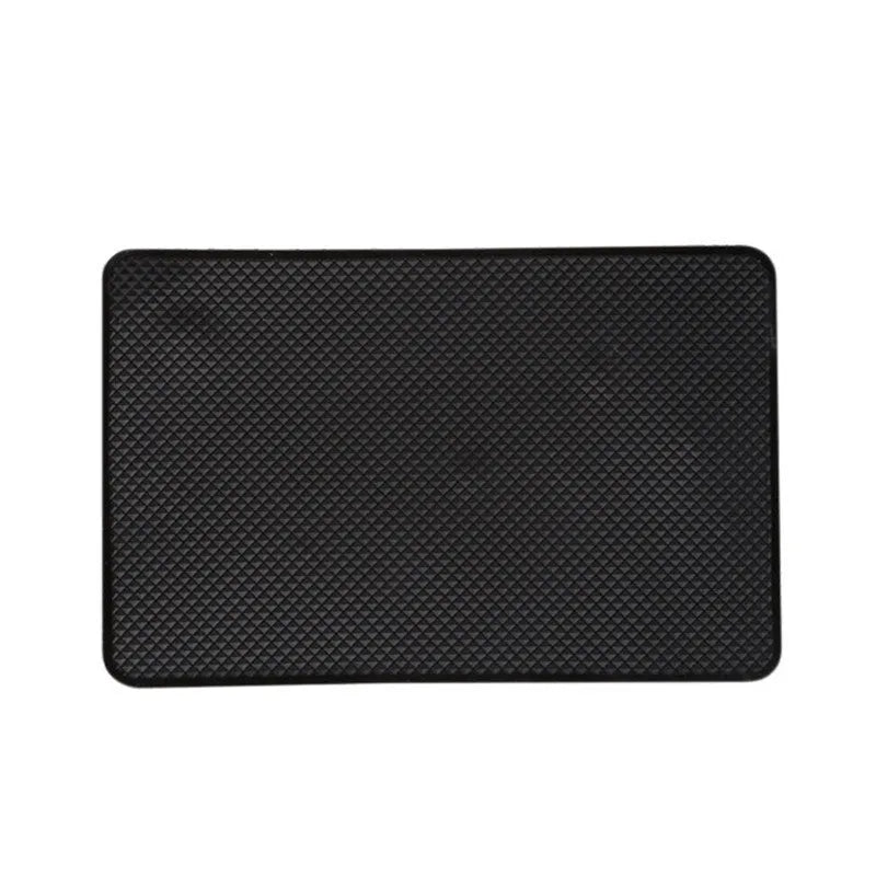 Black small mesh non-slip mat 18x13cm on car dashboard holding mobile phone and coins