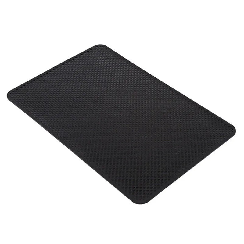 Black small mesh non-slip mat 18x13cm on car dashboard holding mobile phone and coins