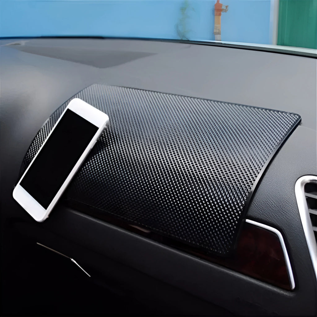 Black small mesh non-slip mat 18x13cm on car dashboard holding mobile phone and coins