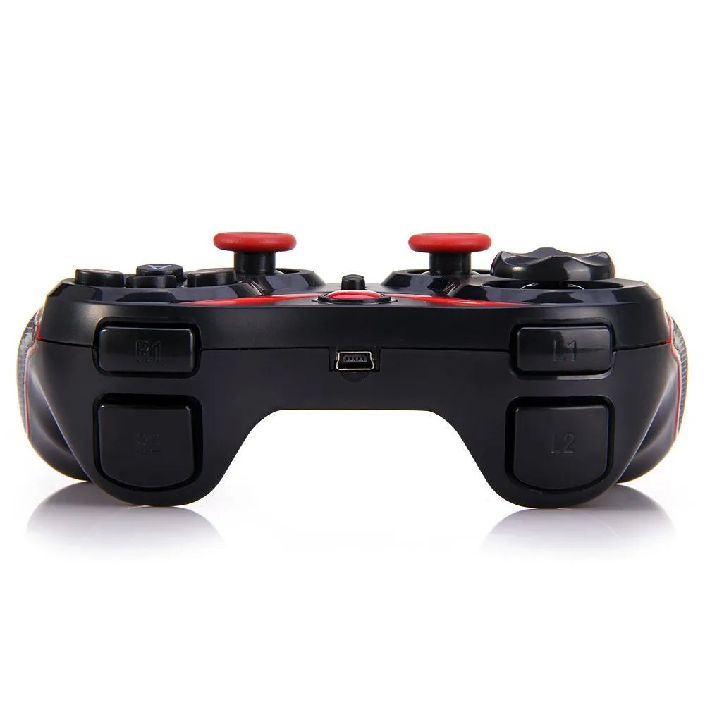 Black wireless Bluetooth mobile game controller with charging cable on a table.
