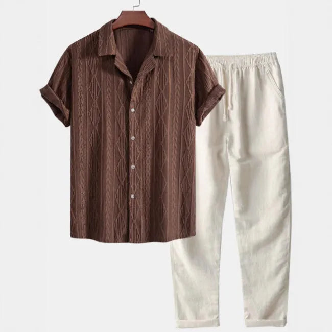 Man wearing a slim-fit short sleeve camouflage print shirt and matching trousers casual suit set.