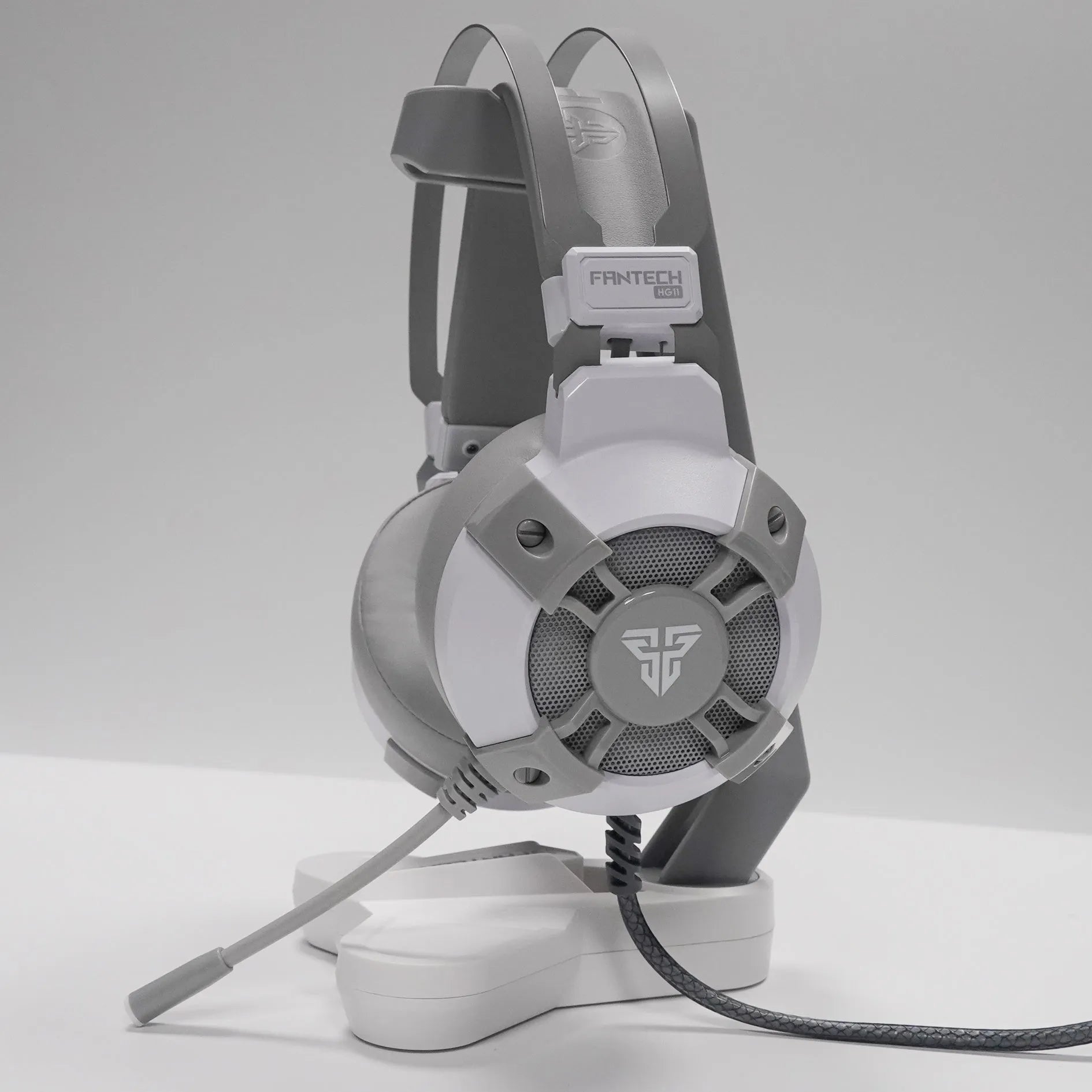 Black Fantech HG11 USB gaming headset with RGB lights on the earcups and an inline remote control on the cable.