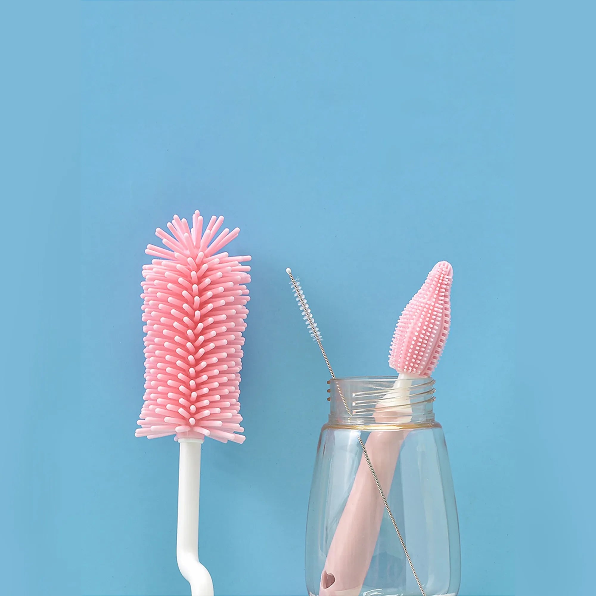 Silicone baby bottle brush set with straw cleaning brush in pink, blue, and yellow
