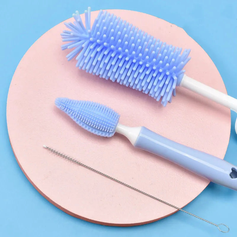 Silicone baby bottle brush set with straw cleaning brush in pink, blue, and yellow