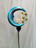 Solar-powered blue moon garden light with wrought iron frame and glass ball