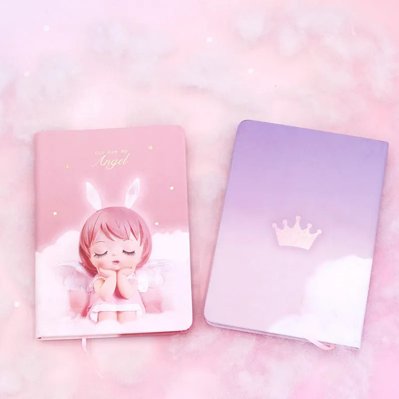 Pink flower fairy design notepad with PU leather cover, shown open on a desk.
