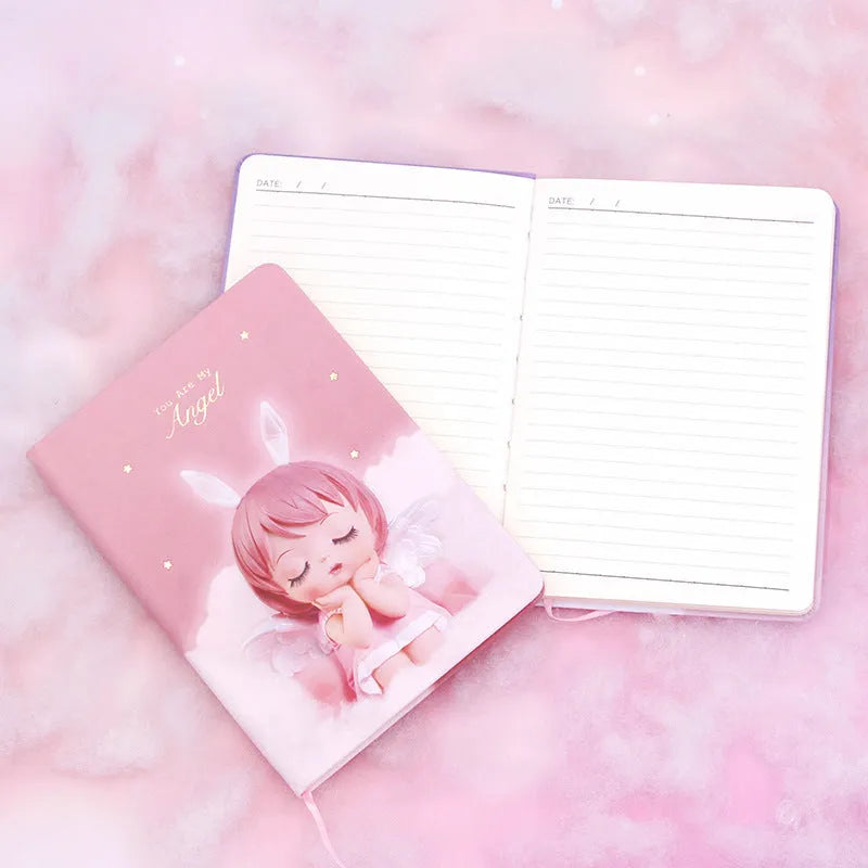 Pink flower fairy design notepad with PU leather cover, shown open on a desk.
