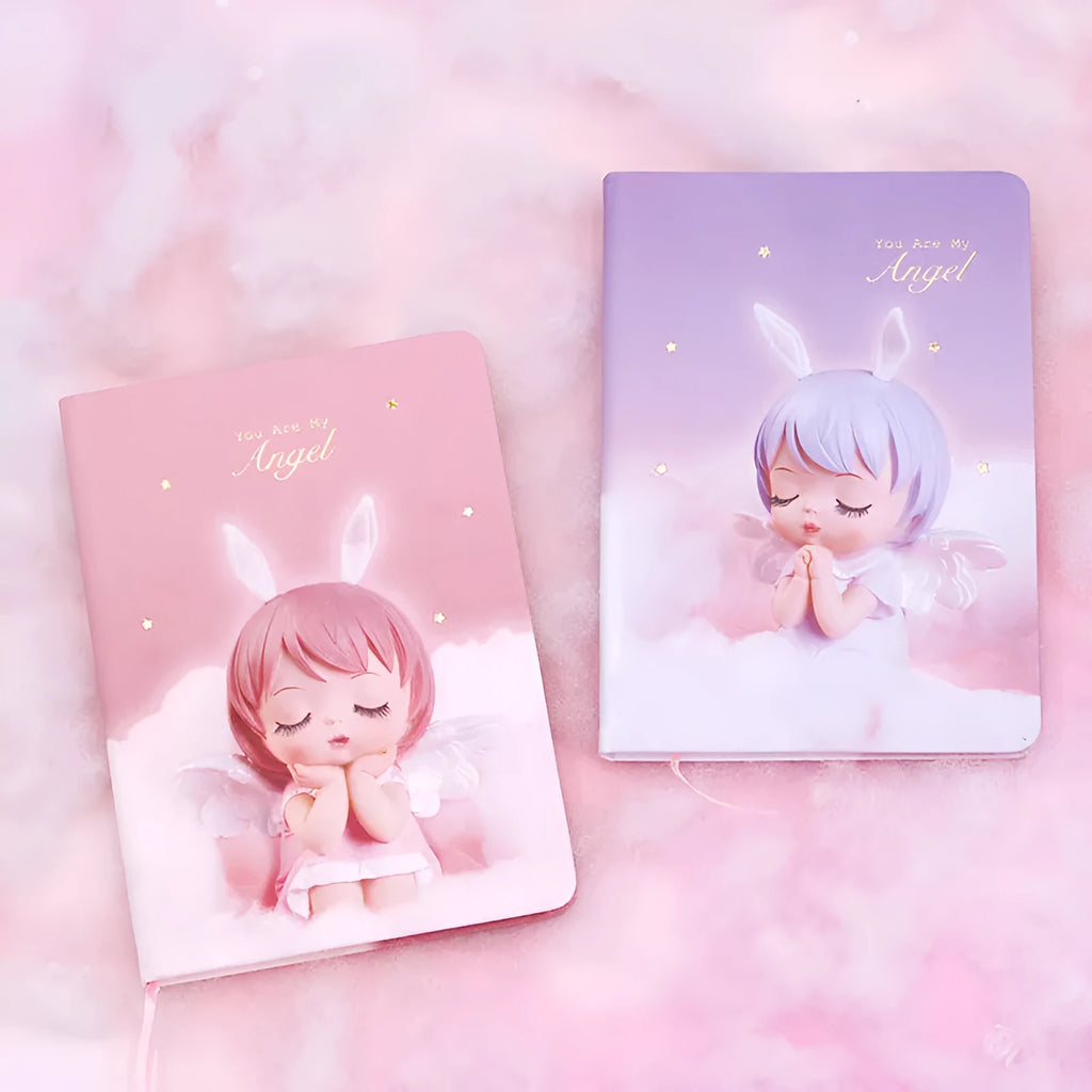 Pink flower fairy design notepad with PU leather cover, shown open on a desk.