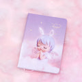 Pink flower fairy design notepad with PU leather cover, shown open on a desk.