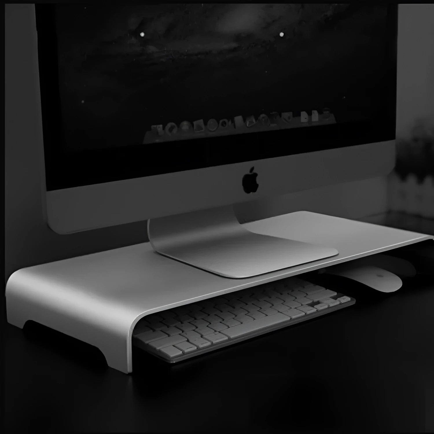 Silver aluminium alloy monitor riser with dimensions 50x22x6cm on a desk