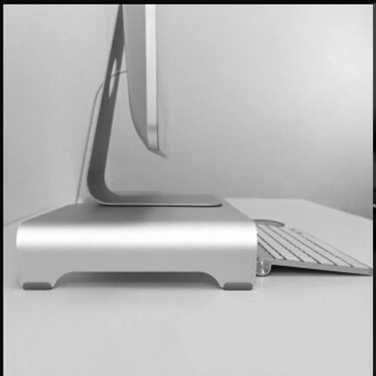 Silver aluminium alloy monitor riser with dimensions 50x22x6cm on a desk