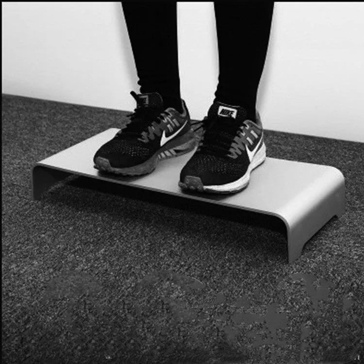Silver aluminium alloy monitor riser with dimensions 50x22x6cm on a desk
