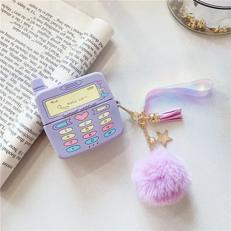 Purple silicone clamshell case for Apple AirPods Pro and AirPods 1 2 with a white fur ball pendant.