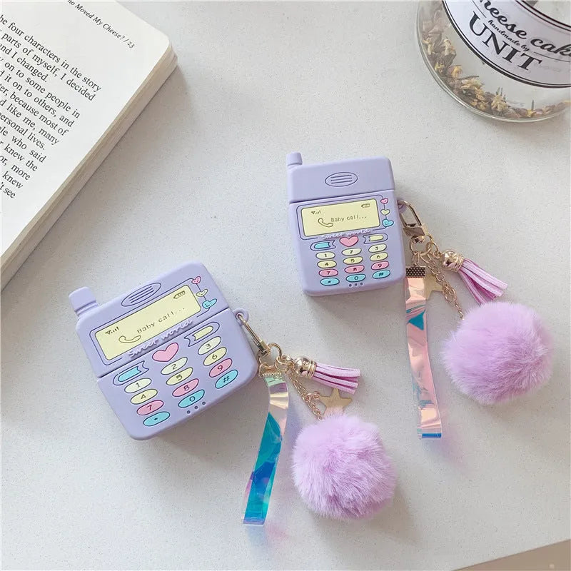 Purple silicone clamshell case for Apple AirPods Pro and AirPods 1 2 with a white fur ball pendant.