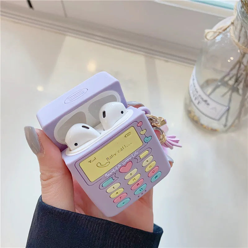 Purple silicone clamshell case for Apple AirPods Pro and AirPods 1 2 with a white fur ball pendant.