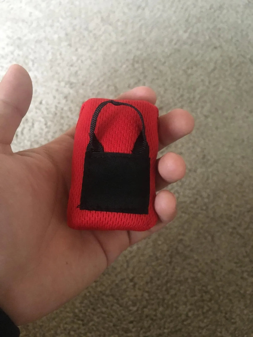 Red nylon picnic mat folded with hand-woven belt, 50g weight, waterproof, diamond lattice texture