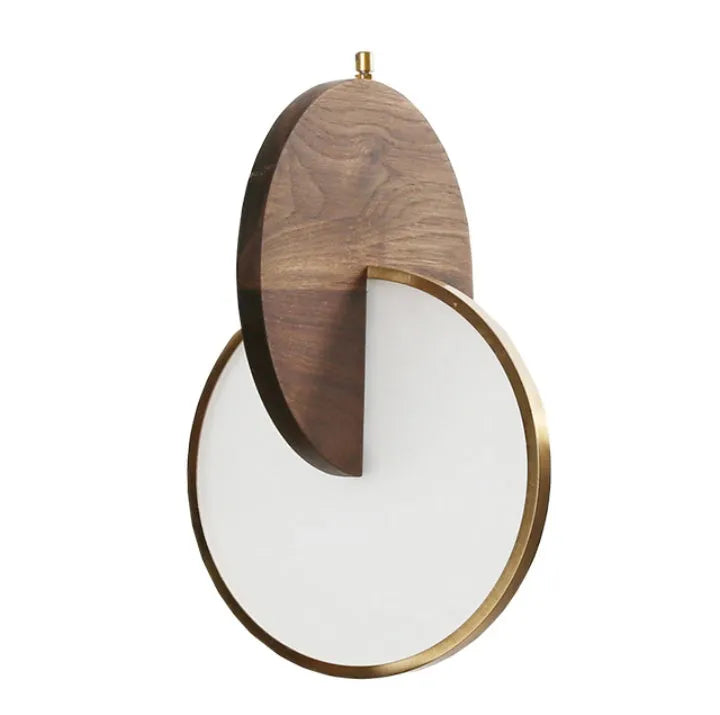Long-line modern chandelier made from carved solid walnut wood, mounted on a wall.