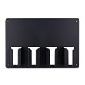 Black plastic wall-mounted frame holding four hair clippers for salon or home storage.