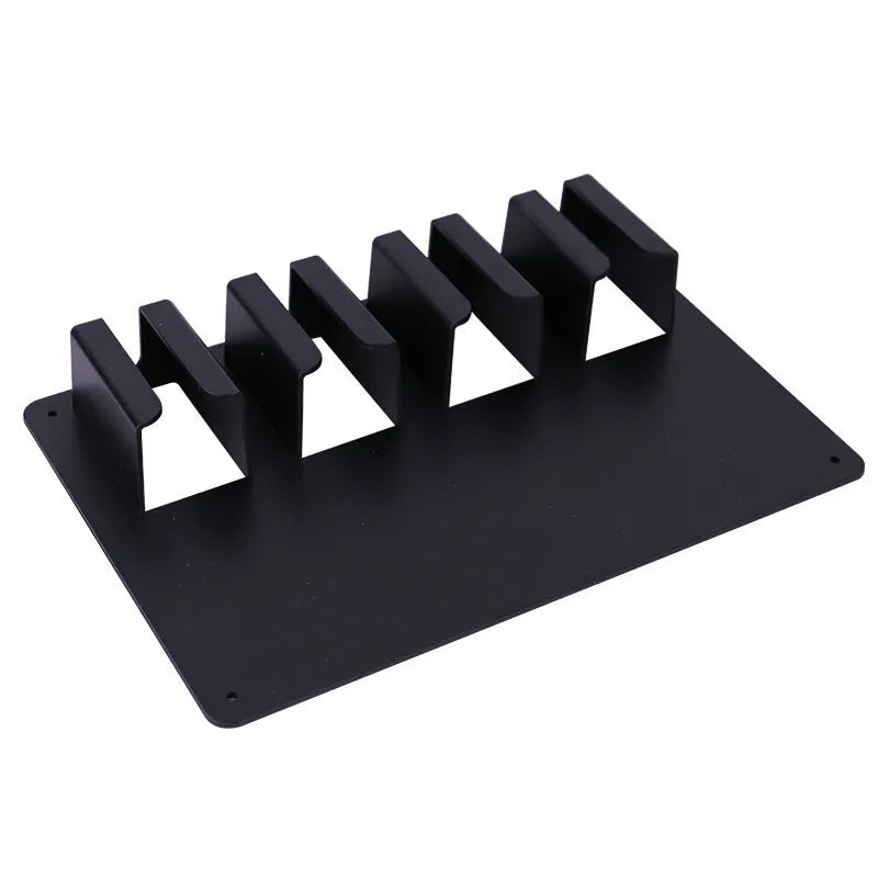 Black plastic wall-mounted frame holding four hair clippers for salon or home storage.
