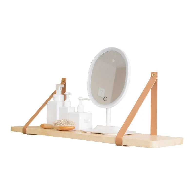Pine wood wall-mounted storage shelf in Nordic style, 50cm wide by 16cm deep, holding books and remote controls.