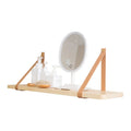 Pine wood wall-mounted storage shelf in Nordic style, 50cm wide by 16cm deep, holding books and remote controls.