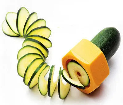 Yellow and green plastic vegetable cutter for spiral slicing cucumbers