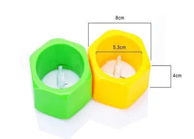 Yellow and green plastic vegetable cutter for spiral slicing cucumbers