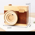 Wooden rotating music box with camera design in miniature carton packaging, pine wood construction