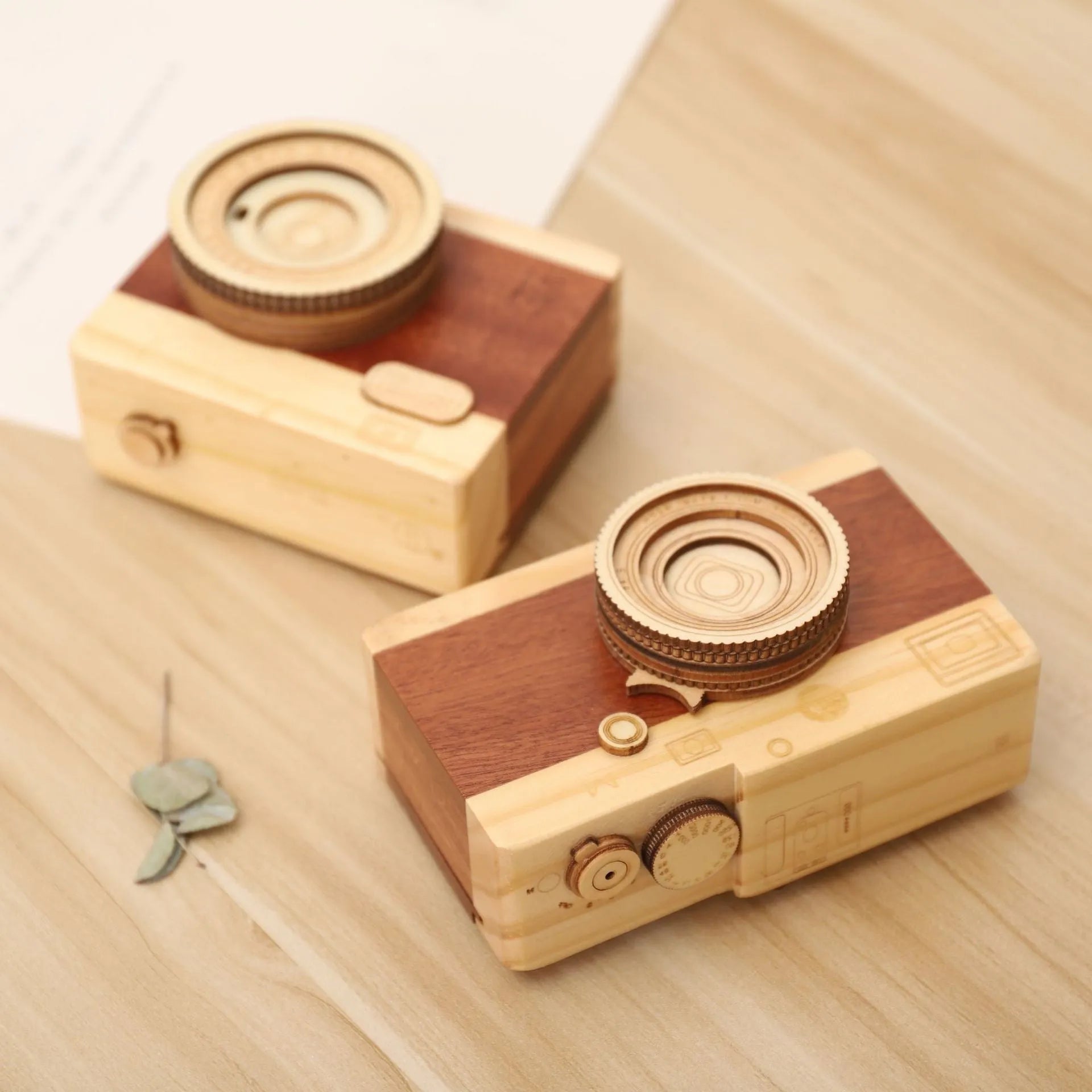 Wooden rotating music box with camera design in miniature carton packaging, pine wood construction
