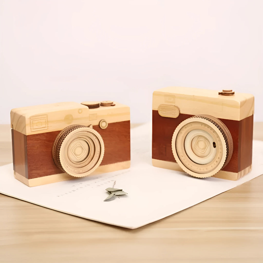 Wooden rotating music box with camera design in miniature carton packaging, pine wood construction
