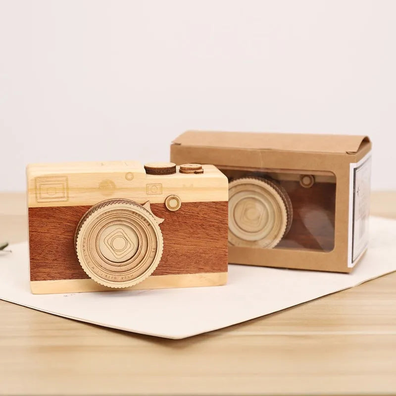 Wooden rotating music box with camera design in miniature carton packaging, pine wood construction
