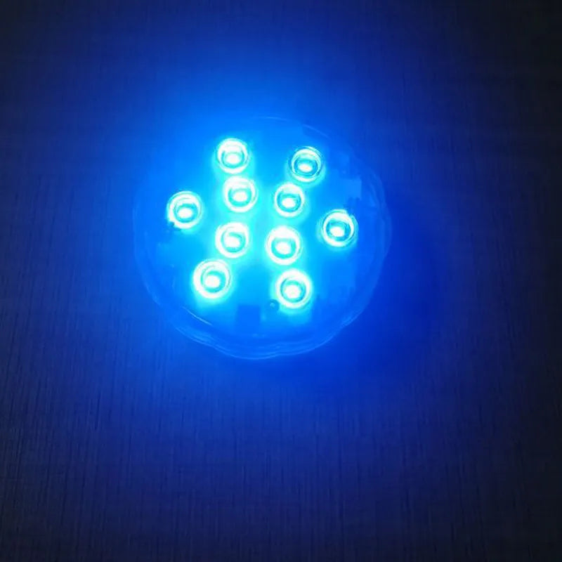 White waterproof disc LED light with remote control for swimming pools and garden decoration.