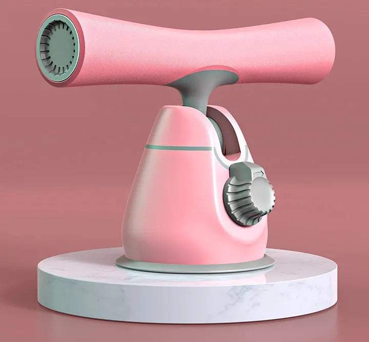 Women's sit-up aid with suction cup base, thick foam foot pad, and adjustable height mechanism on a home floor