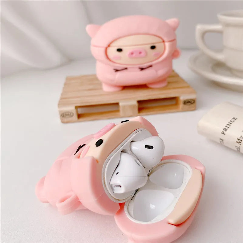 Pink silicone AirPods case cover with cartoon pig design and a metal hook attached