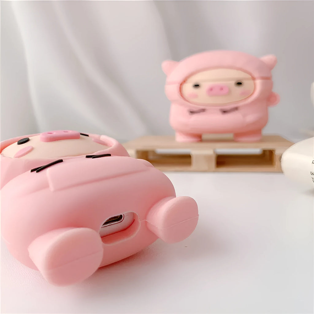 Pink silicone AirPods case cover with cartoon pig design and a metal hook attached