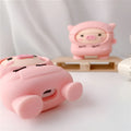 Pink silicone AirPods case cover with cartoon pig design and a metal hook attached