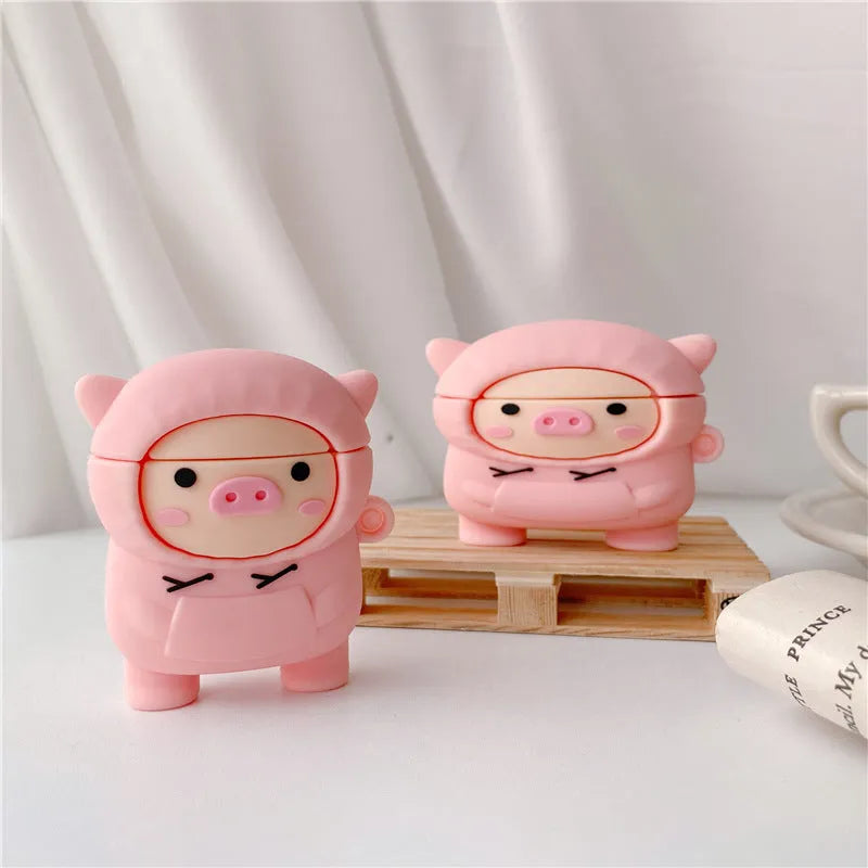 Pink silicone AirPods case cover with cartoon pig design and a metal hook attached