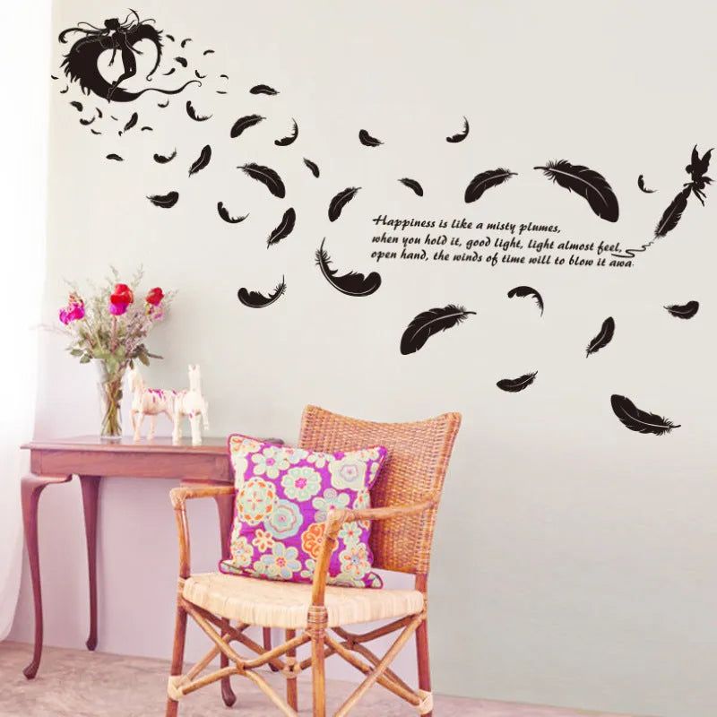 Black feather angel three generations removable wall sticker on a white wall.