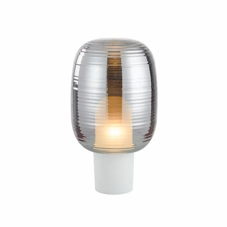Modern Nordic style glass table lamp in cognac colour with push button switch.